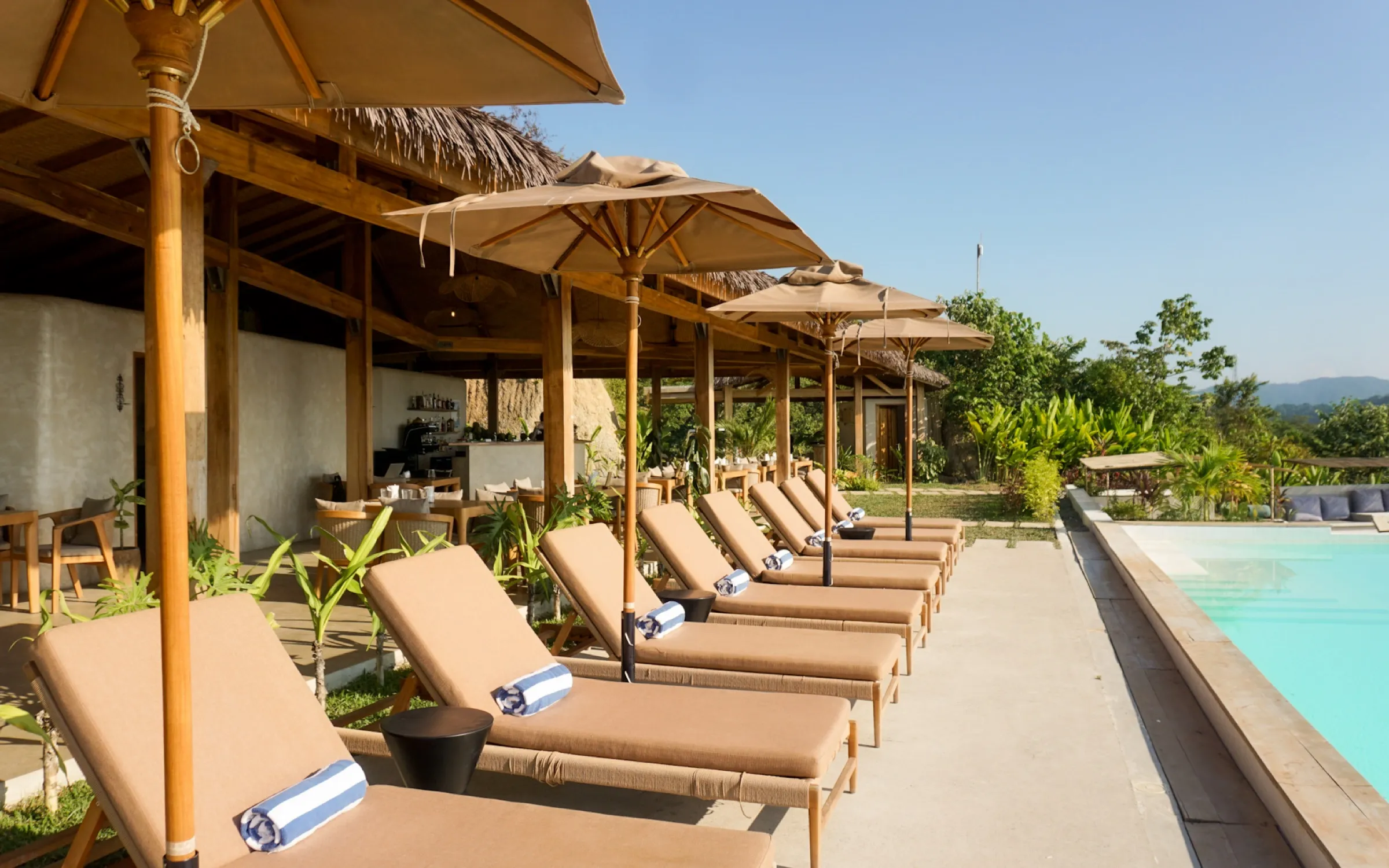Sun loungers beside the infinity pool at Atalaya Resort