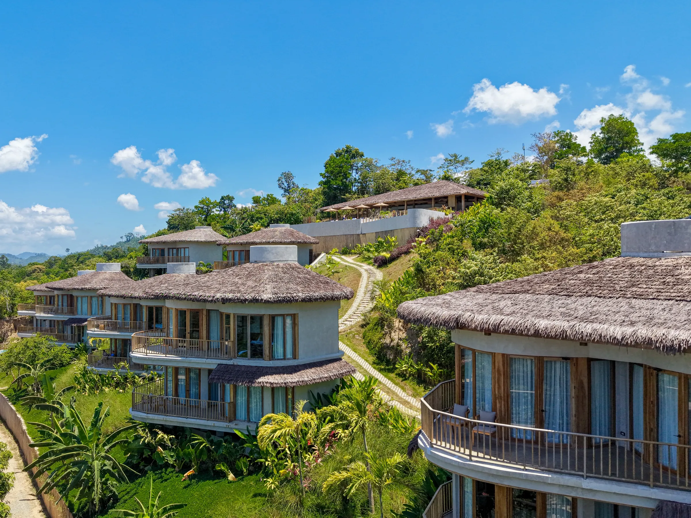 Atalaya Resort's thatched villas stepping down the forested hillside